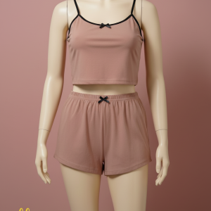 Relax in style with this comfortable two-piece loungewear set. It includes a cropped cami top with delicate spaghetti straps and matching elastic-waist shorts, both adorned with small bow details for a touch of charm.