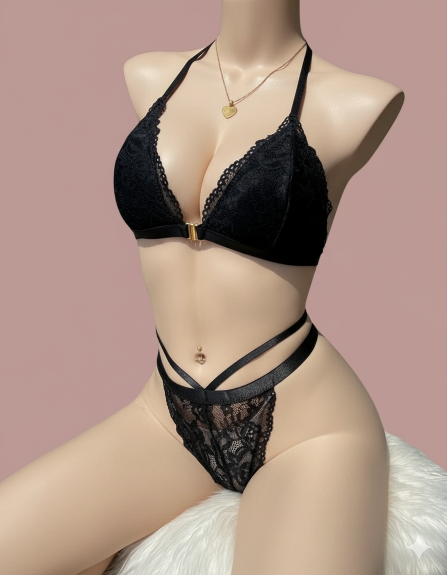 A luxurious and intricate two-piece set featuring a delicate lace halter bra with a front clasp, and a matching lace thong/G-string accented with alluring waist straps.