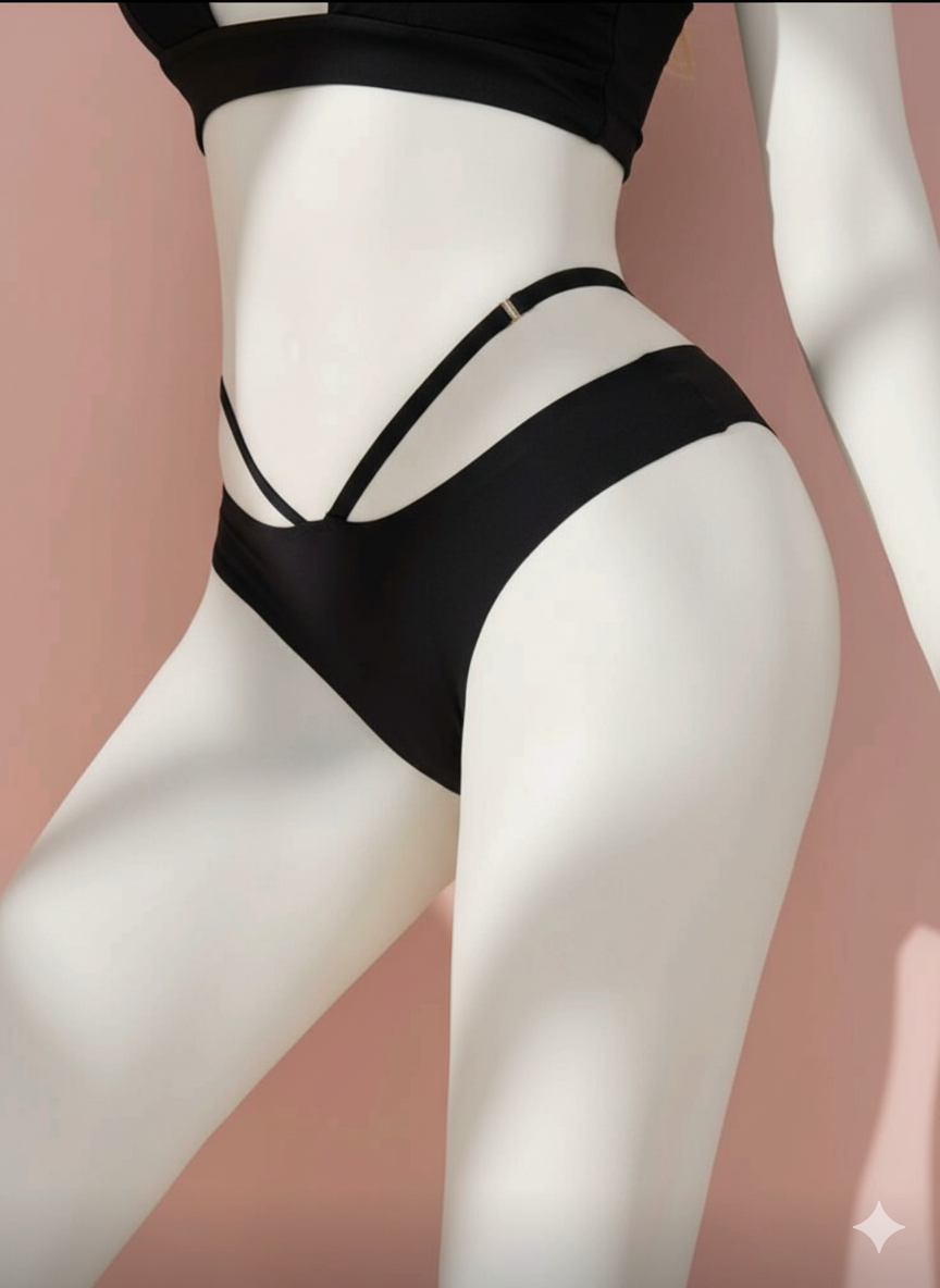 A modern and seductive panty featuring a comfortable seamless construction for invisibility under clothing. Enhanced with two sleek, crisscrossing straps at the waist/hips for an eye-catching, unique silhouette.