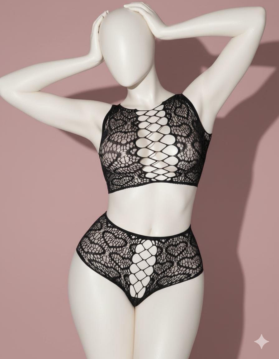 A bold and seductive two-piece set crafted from sheer, intricate openwork mesh/lace. Features a high-neck crop top and matching high-waisted shorts, both accented with provocative lace-up detailing down the center front.