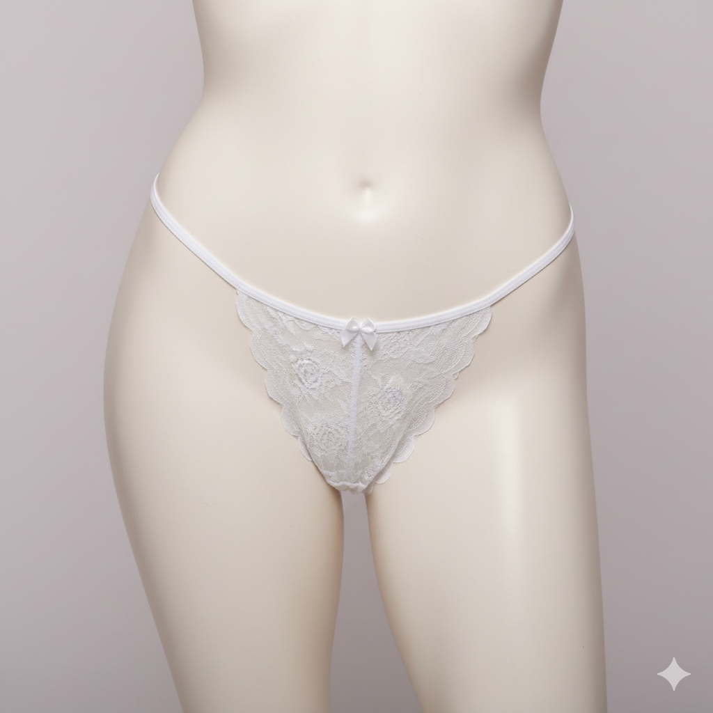 An alluring and provocative G-string panty crafted from delicate sheer floral lace. This piece features a captivating open design at the crotch and is adorned with sweet ribbon bows and thin, adjustable side straps.