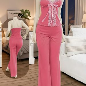 An exquisitely soft two-piece sleepwear set designed for comfort and feminine style. It features a delicate camisole top adorned with lace and ribbon details, paired with comfortable wide-leg pants crafted from a plush, ribbed fabric.
